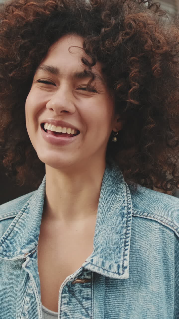 Woman with Curly Hair and Denim Jacket