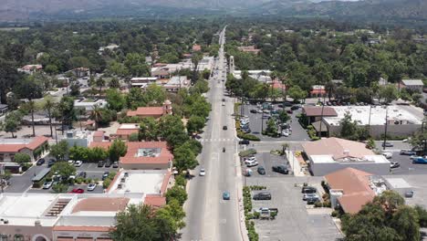 Low-aerial-shot-flying-over-charming-downtown-Ojai-in-California