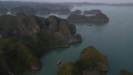 drone shot flying over epic islands in cat ba and halong bay in northern vietnam