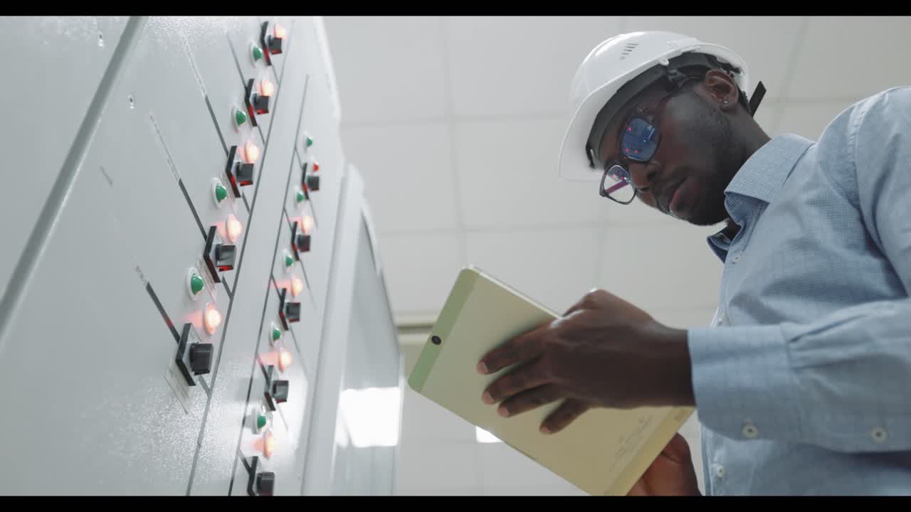 Engineer working on a control panel
