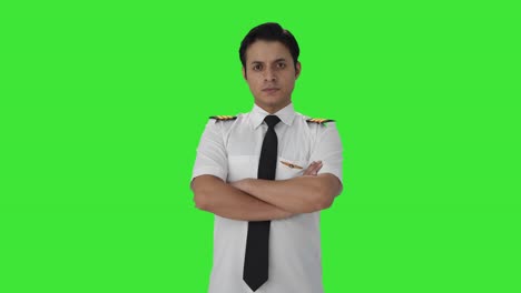 portrait of indian male pilot green screen