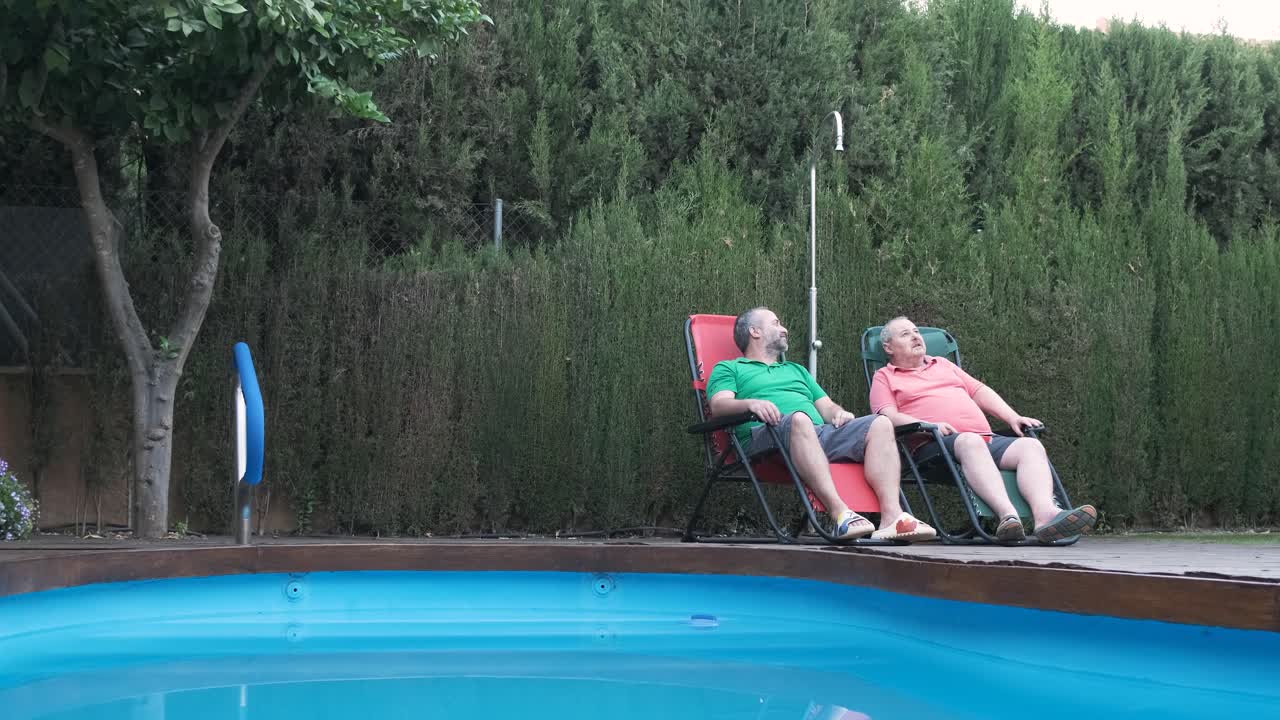 People relaxing by the pool