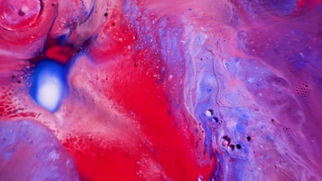 abstract movement of acrylic paints. view from above. incredible color mixing patterns