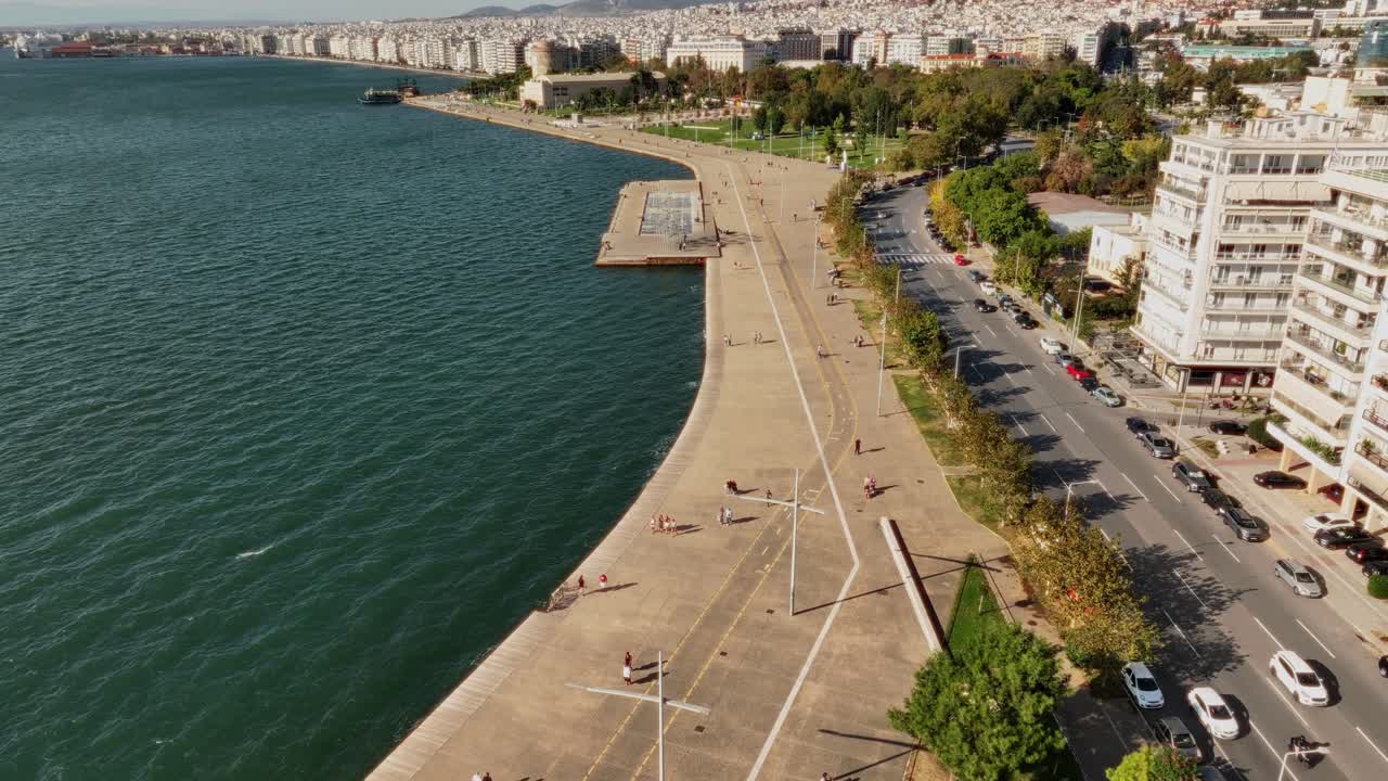 Tilt down of the coastline of the city of Thessaloniki on a sunny day, Greece.
