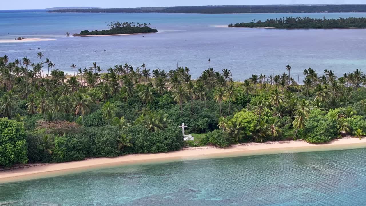 Tropical island scenery of Tonga, Polynesia. Drone pull back from grave in paradise island.