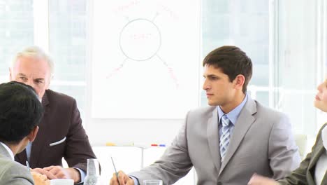 Panorama-of-business-people-sitting-in-a-meeting