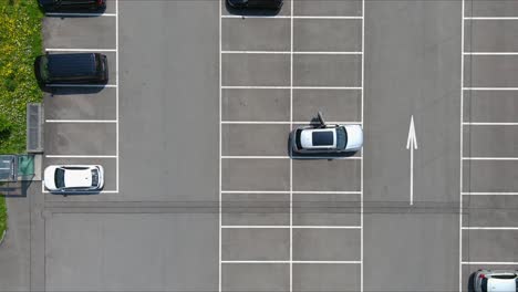 Morschach-Flyover:-Moving-Over-Scenic-Water-Valley-Towards-Alps-Mountains,-Switzerland,-Europe,-Drone-|-Top-Down-Cinematic-Moment-over-Parked-Car-With-Open-Door