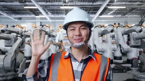 factory worker with industrial robots