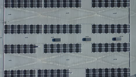 aerial looks directly down onto solar panels installed on building roof