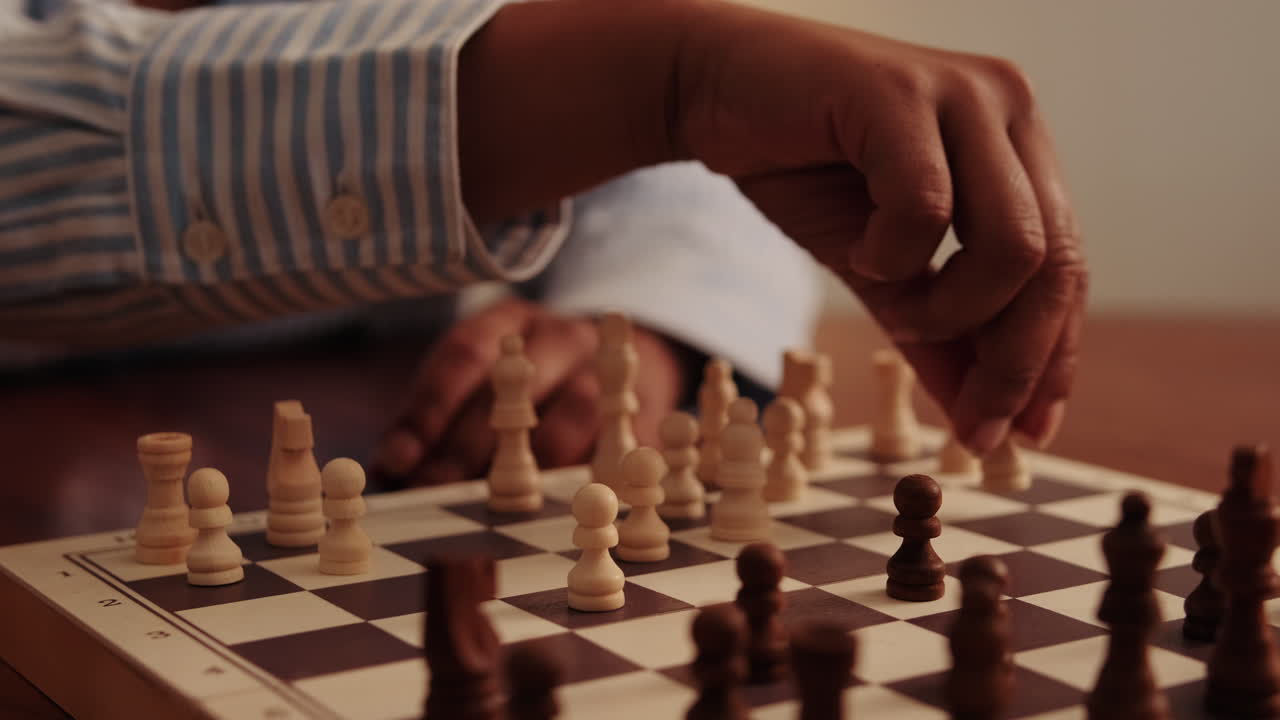 Chess Player Makes A Move On The Board