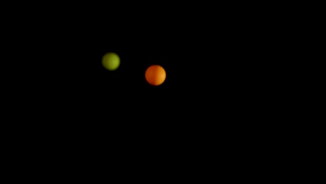 vibrant balls bouncing against a dark background