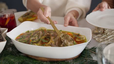 Women-sharing-a-food-with-family-at-Christmas-Eve