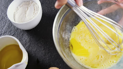 woman whisking egg in bowl 4k