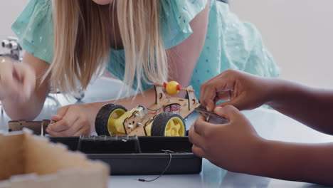 Two-Students-Building-And-Programing-Robot-Vehicle-In-After-School-Computer-Coding-Class