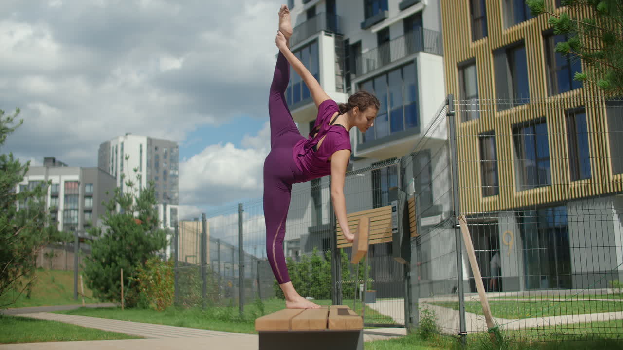 Woman Stretching in Urban Park