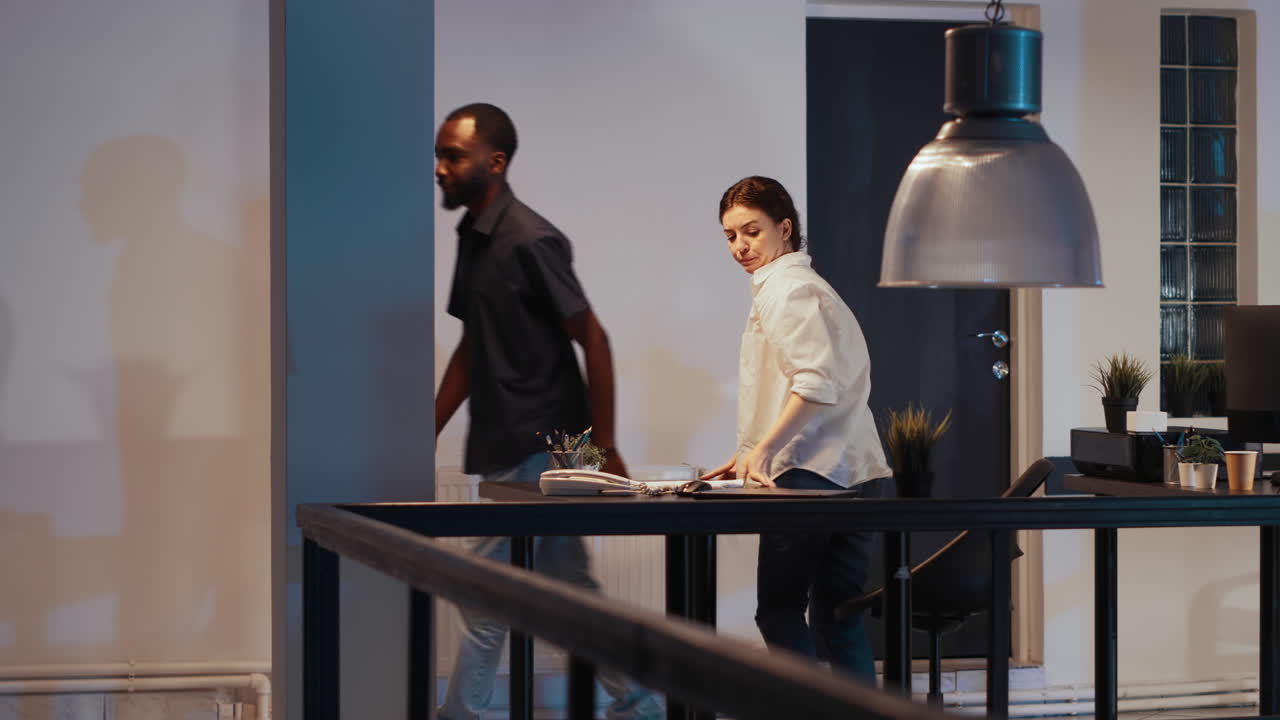 Female freelancer leaving startup office late at night