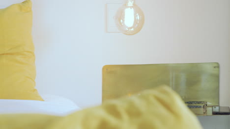 cozy home setting with warm lighting, glasses, and tea on shelf