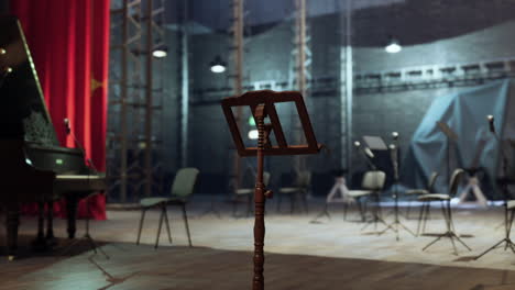 a music stand on a stage in a concert hall