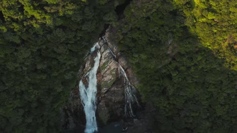 ohko waterfall, top down aerial view in yakushima japan at sunset