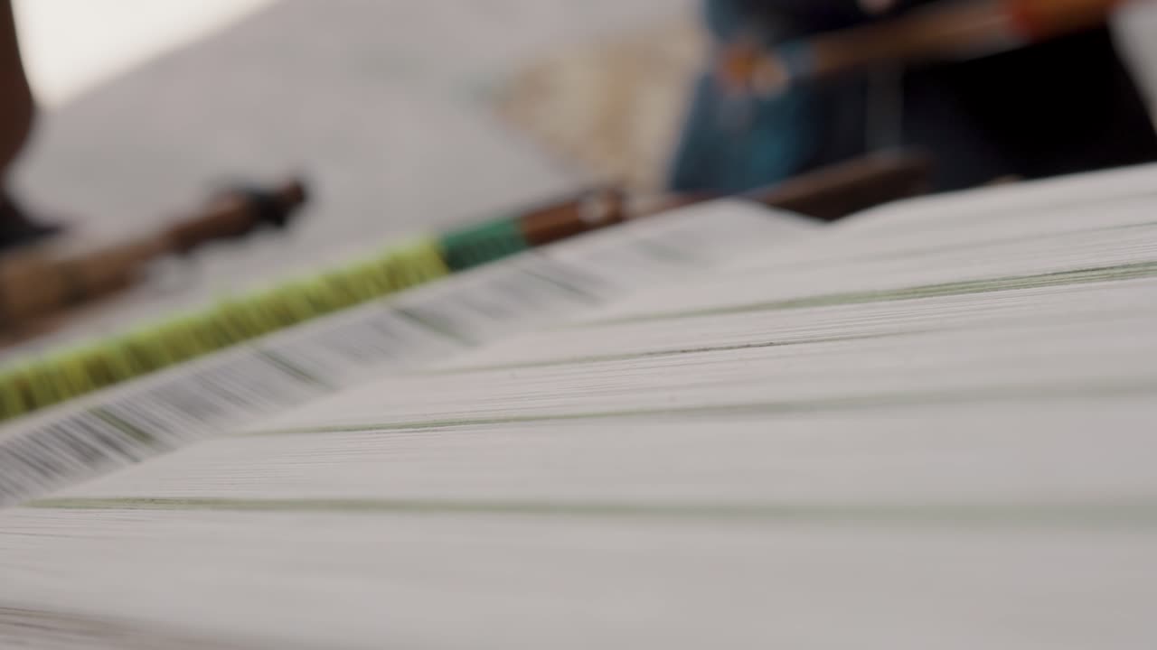 Local Mayan Female Weaver Weaving Threads On Traditional Loom