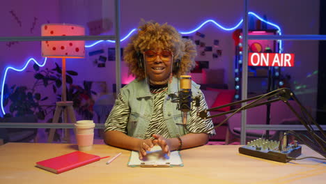 woman podcast host in a radio studio