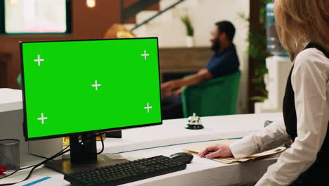 Hotel-staff-working-with-pc-greenscreen