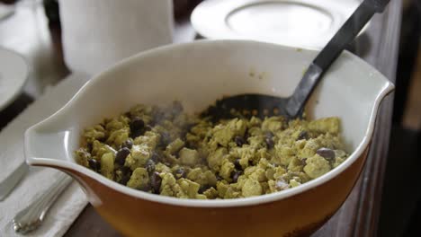 Delicious-vegan-tofu-scramble-steaming-hot-in-slow-motion-4K