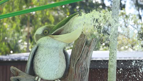 kookaburra statue with water spray effect