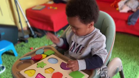 two year old baby playing happy and funny learning colours and shapes
