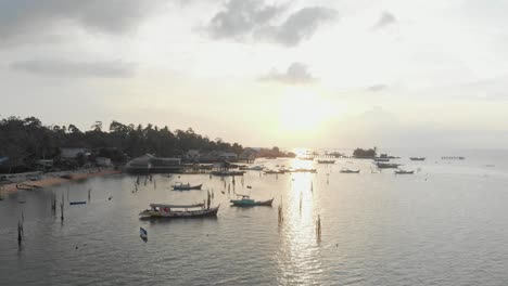 side panning shot of tanjung binga during sunset at beliting, aerial