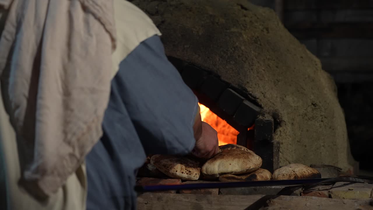 Traditional Semi-Sphere Oven with Red Flames Baking Delicious Dough Inside