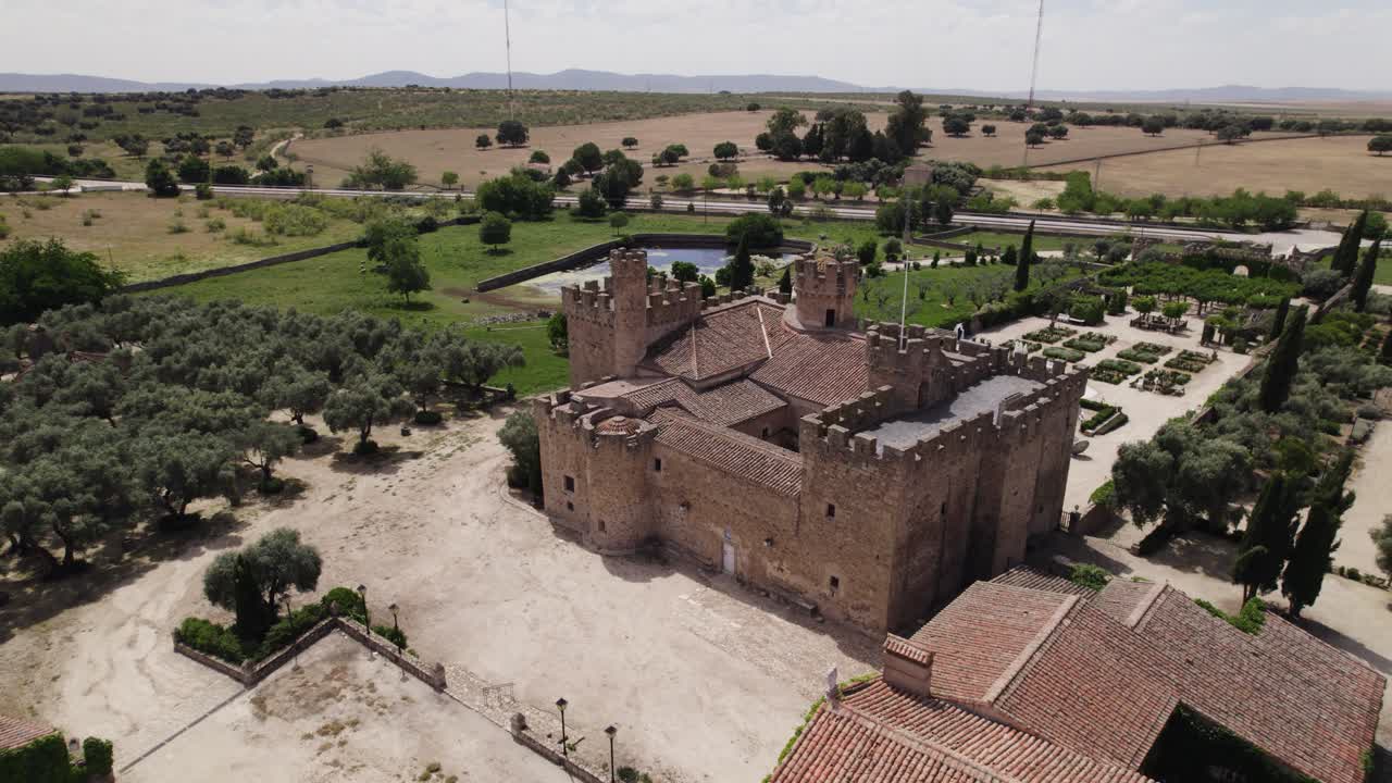 Aerial view circling the castle of Arguijuelas de Abajo courtyard grounds in the city of C&aacute;ceres, Spain