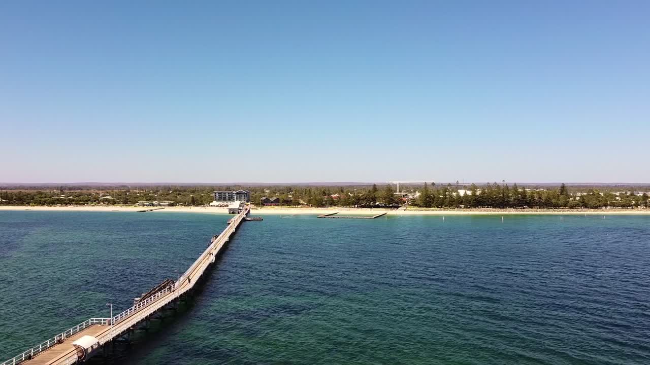 Scenic View of a Long Pier and Coastal Town