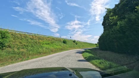 driving through hills and vineyards in italy