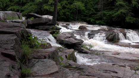 A-waterfall-flows-through-the-forest-in-New-Hampshire