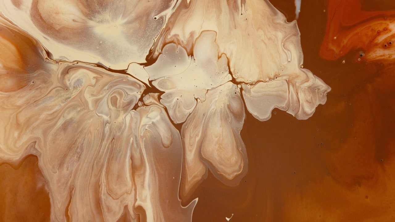 Brown paint spreading organically