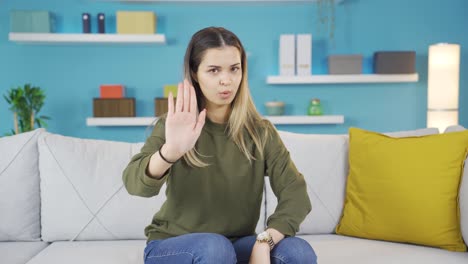 the young girl solemnly gives a stop warning, says no.