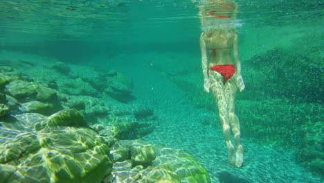 a young woman enjoying an underwater swim