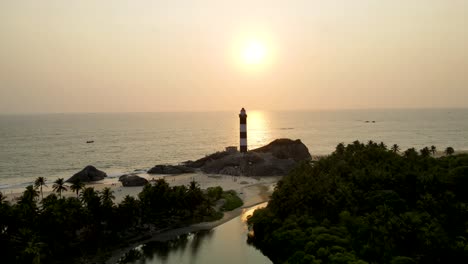 aerial drone shot of kapu beach and lighthouse in udupi