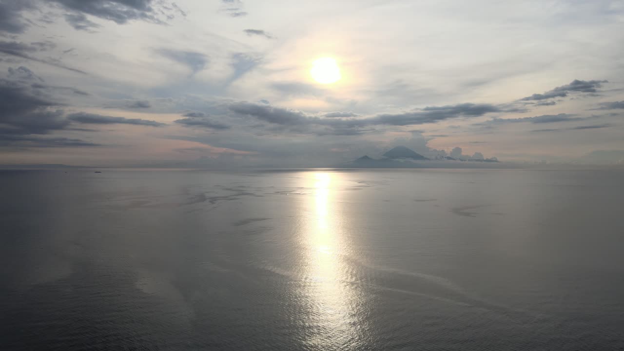 Golden Sun Reflection on Calm Ocean Water at Sunset