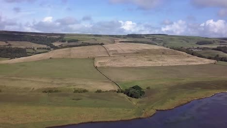 Extremely-wide-aerial-shot-centring-on-the-Chapel-of-St-Catherine's-near-the-village-of-Abbotsbury,-Dorset