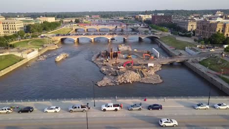 Aerial-Drone-Footage-Of-The-Des-Moines-River,-Bridges-And-A-Construction-Site-Near-Downtown-Des-Moines-Iowa