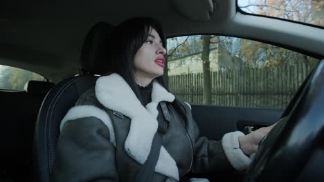 confident businesswoman driving her car, dressed in elegant business attire, showcasing independence and professionalism in a modern vehicle interior