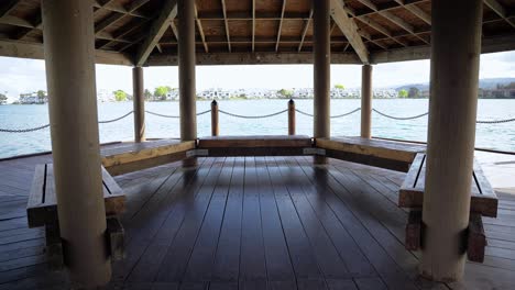 The-interior-of-a-wooden-gazebo-by-the-lake