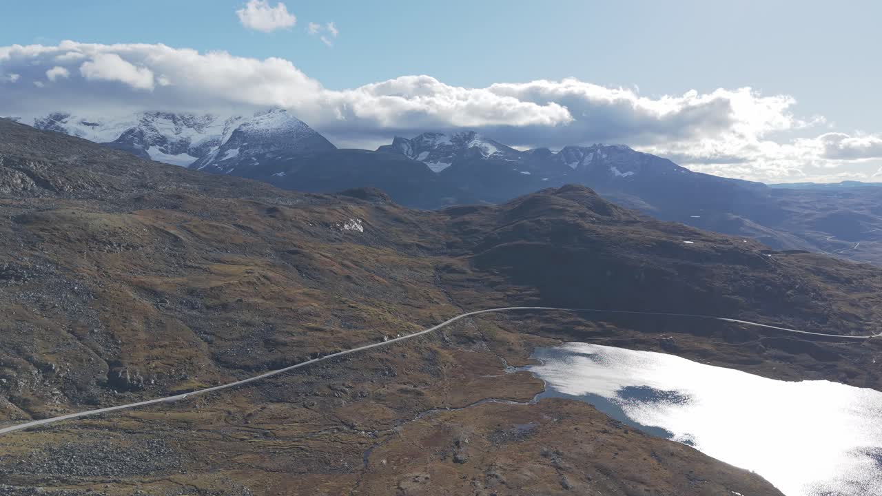 Panorama view of a National scenic route in Norway going over mountains. Areal footage