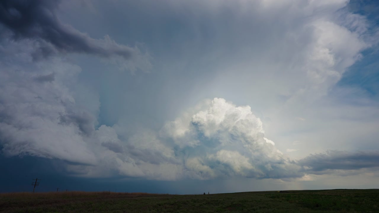 Building thunderstorm clouds growing and moving across dramatic sky