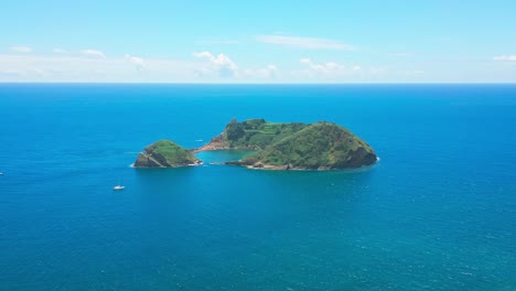 Vila-Franca-Islet-surrounded-by-the-deep-blue-ocean-on-a-sunny-day