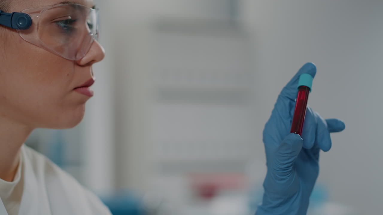 Microbiologist analyzing dna substance in test tube