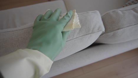 cleaning a light gray fabric sofa