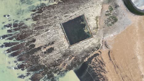 Overhead birds eye drone aerial view tidal pool Broadstairs Kent UK